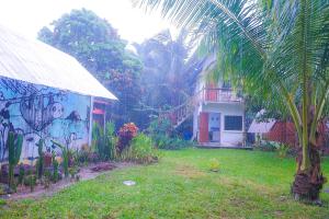 a house with a mural on the side of it at Lazy Bones in Koh Rong Sanloem