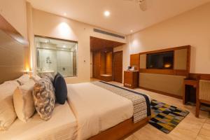 Postel nebo postele na pokoji v ubytování Vibe Munnar Resort & Spa