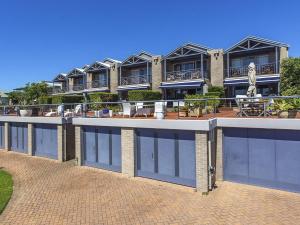 a building with a lot of windows on it at Aroona at Minnamurra in Minnamurra