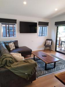 a living room with a couch and a coffee table at Marysville Holiday Park in Marysville