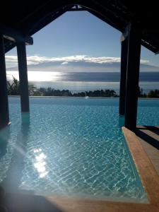 a view of the water from a swimming pool at Villa BellaVista in Teavaro