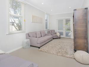 a living room with two chairs and a couch at Blake House - SPECIAL OFFER STAY 3 PAY for 2 OR 25PERCENT OFF MIDWEEK in Kiama