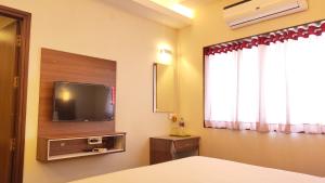 TV a/nebo společenská místnost v ubytování Hotel Rhythm Grand Suite