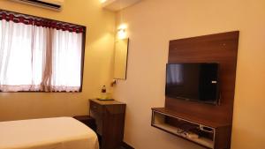 TV a/nebo společenská místnost v ubytování Hotel Rhythm Grand Suite