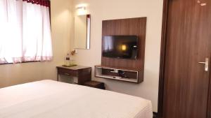 TV a/nebo společenská místnost v ubytování Hotel Rhythm Grand Suite