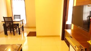 Kuchyň nebo kuchyňský kout v ubytování Hotel Rhythm Grand Suite