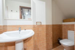 A bathroom at POC A POC SUITES