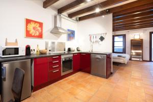 A kitchen or kitchenette at POC A POC SUITES