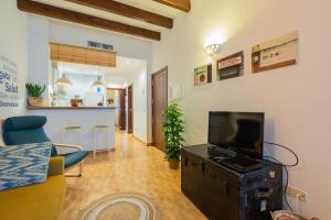 A television and/or entertainment centre at POC A POC SUITES