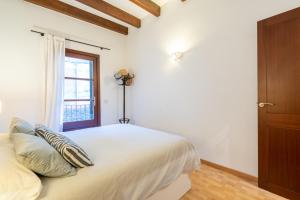 A bed or beds in a room at POC A POC SUITES