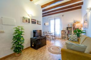 A television and/or entertainment centre at POC A POC SUITES