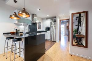 A kitchen or kitchenette at POC A POC SUITES