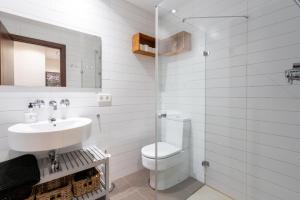A bathroom at POC A POC SUITES