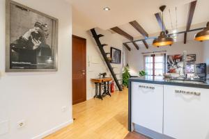 A kitchen or kitchenette at POC A POC SUITES