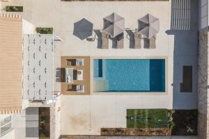 Bazén v ubytovaní Evaero Villas I, II, III, IV, Family Retreats, By ThinkVilla alebo v jeho blízkosti