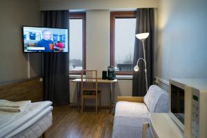 TV a/nebo společenská místnost v ubytování Forenom Aparthotel Kemi