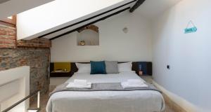 Posteľ alebo postele v izbe v ubytovaní JOIVY Cosy Apt in Como Centre