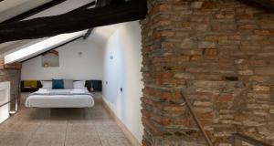 Posteľ alebo postele v izbe v ubytovaní JOIVY Cosy Apt in Como Centre