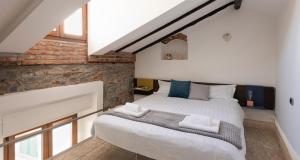 Posteľ alebo postele v izbe v ubytovaní JOIVY Cosy Apt in Como Centre
