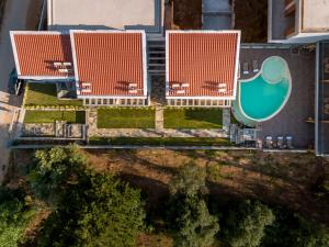 an overhead view of buildings with a swimming pool at La Isola Verde in Skala Potamias