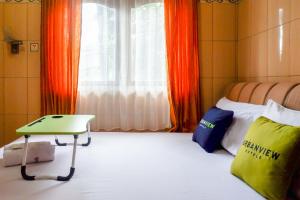Postel nebo postele na pokoji v ubytování Urbanview Hotel Anugrah Kendal by RedDoorz + 37 fotografií