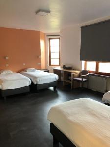 מיטה או מיטות בחדר ב-Hotel Hinterland