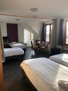 Postel nebo postele na pokoji v ubytování Hotel Hinterland