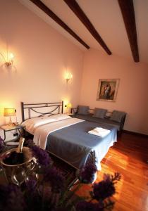 מיטה או מיטות בחדר ב-Hotel Isola Di Caprera