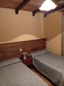 A bed or beds in a room at Casa rural khaleesi