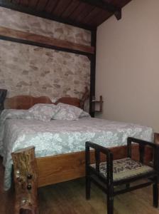 A bed or beds in a room at Casa rural khaleesi