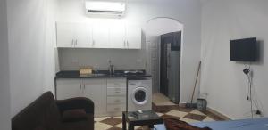 A kitchen or kitchenette at Studio pool view next to the Marina,Sheraton Plaza 320