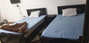A bed or beds in a room at Studio pool view next to the Marina,Sheraton Plaza 320