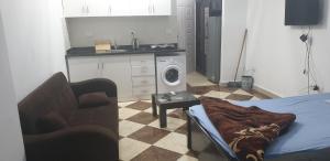 A kitchen or kitchenette at Studio pool view next to the Marina,Sheraton Plaza 320