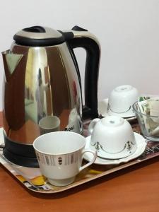 Příslušenství pro přípravu čaje a kávy v ubytování Dama HostelBB