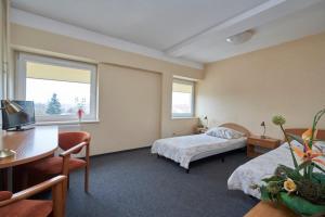 Posteľ alebo postele v izbe v ubytovaní Hostel Relaks