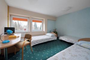 Posteľ alebo postele v izbe v ubytovaní Hostel Relaks