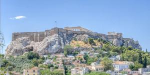 a view of a mountain with houses on it at Royal Luxury Suite in Athens