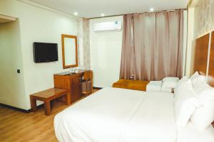 Voodi või voodid majutusasutuse Hotel Perce Neige toas