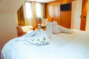 Voodi või voodid majutusasutuse Hotel Perce Neige toas