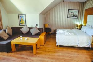 Voodi või voodid majutusasutuse Hotel Perce Neige toas