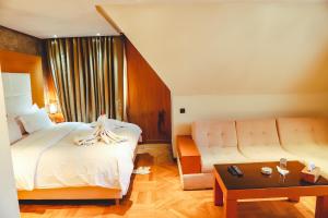 Voodi või voodid majutusasutuse Hotel Perce Neige toas