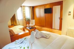 Voodi või voodid majutusasutuse Hotel Perce Neige toas