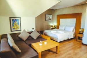 Voodi või voodid majutusasutuse Hotel Perce Neige toas