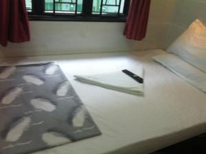 Ένα ή περισσότερα κρεβάτια σε δωμάτιο στο New Cosmos Hotel