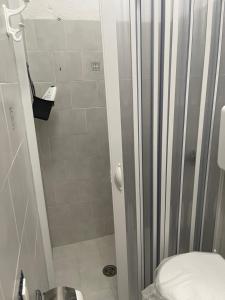 a shower stall with a toilet in a bathroom at A&d in Carrao +9 photos