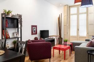 Televízia a/alebo spoločenská miestnosť v ubytovaní SOHO ARTS DUPLEX CENTRO by AlohaMalaga