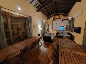 a living room with a couch and a table and chairs at Casa Rural ESTACIÓN DEL SOLDADO in Estación del Soldado