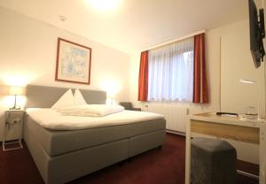 Postel nebo postele na pokoji v ubytování Hotel Altmann