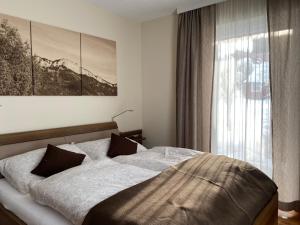 Posteľ alebo postele v izbe v ubytovaní Apartment Steinplatte
