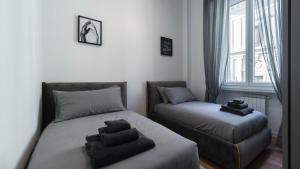 A bed or beds in a room at Cavour 82